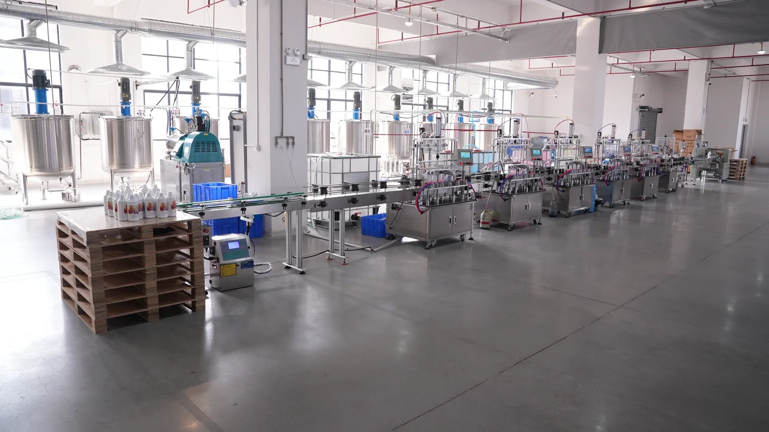 Production workshop with mixing tanks and filling equipment