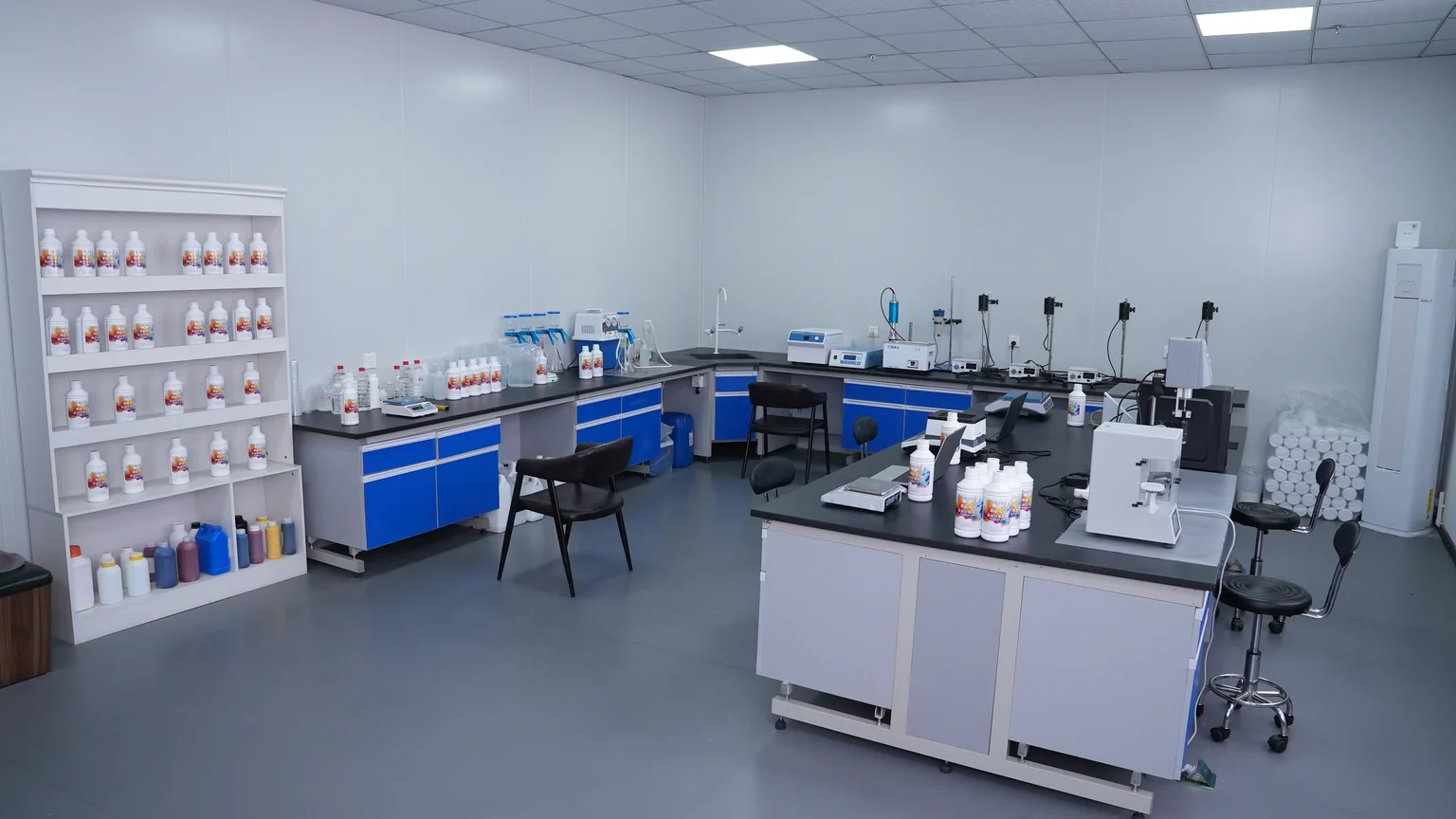 Ink laboratory with sample bottles and testing workstations